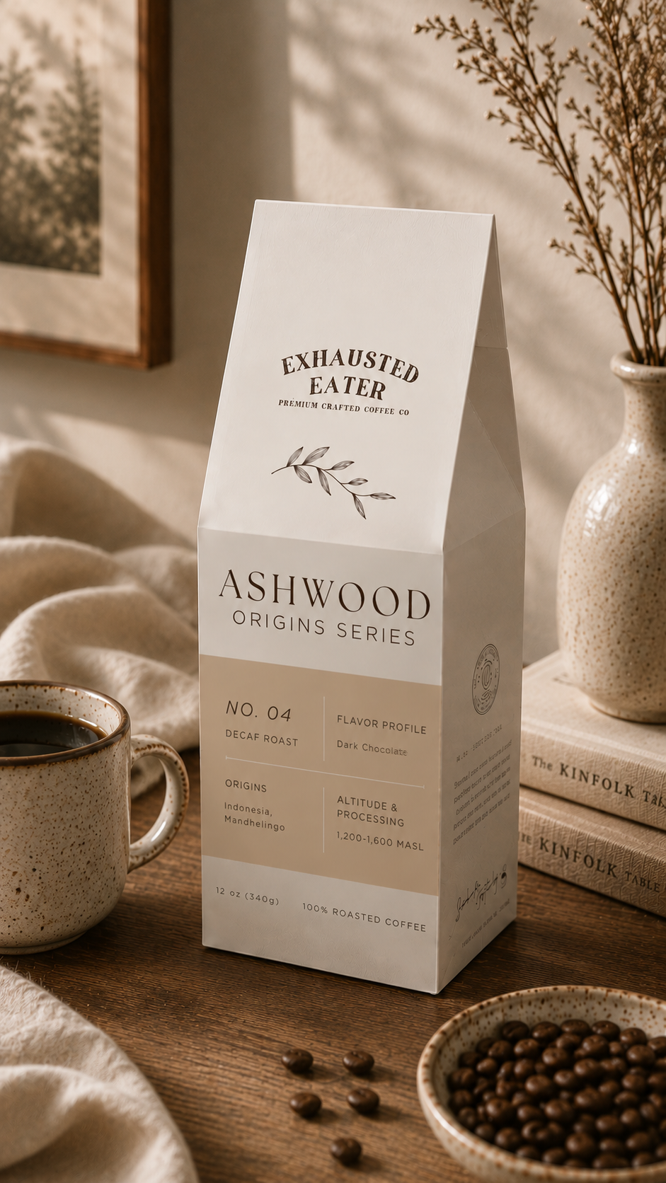 Ashwood Origins Series coffee package on a wooden table with coffee beans and a mug.